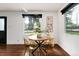 Bright dining area with wood floors and modern table and chairs at 9393 W 14Th Ave, Lakewood, CO 80215