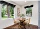 Bright dining area with large windows and wood floors at 9393 W 14Th Ave, Lakewood, CO 80215