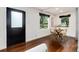 Bright dining area with hardwood floors and modern table at 9393 W 14Th Ave, Lakewood, CO 80215