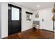 Clean entryway with hardwood floors and modern decor at 9393 W 14Th Ave, Lakewood, CO 80215