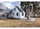 Newly renovated craftsman home with white and brick exterior at 9393 W 14Th Ave, Lakewood, CO 80215