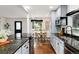 Modern kitchen with granite countertops and stainless steel appliances at 9393 W 14Th Ave, Lakewood, CO 80215