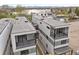 Stunning aerial view of modern homes near a picturesque lake, showcasing contemporary architecture at 1747 Lowell Blvd, Denver, CO 80204