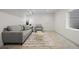 Basement living area with comfortable seating on patterned rug, and a minimalist aesthetic at 1747 Lowell Blvd, Denver, CO 80204