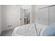 Bright bedroom with closet and view to stairs at 1747 Lowell Blvd, Denver, CO 80204