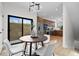Bright dining area with modern light fixture and sliding glass door to outdoor patio at 1747 Lowell Blvd, Denver, CO 80204