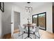 Cozy dining room with modern chandelier and access to outdoor area at 1747 Lowell Blvd, Denver, CO 80204