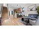Open concept living space with hardwood floors, kitchen island, and modern staircase at 1747 Lowell Blvd, Denver, CO 80204