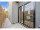 Private patio with sliding glass door to the indoor dining area at 1747 Lowell Blvd, Denver, CO 80204