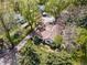 A beautiful aerial view shows the house with mature trees surrounding the property at 1051 Independence St, Lakewood, CO 80215