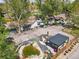 Expansive aerial view showing the home's backyard entertaining area with a pond and pergola at 1051 Independence St, Lakewood, CO 80215