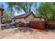 Private backyard with a stone patio, outdoor grill, and a relaxing hot tub at 1051 Independence St, Lakewood, CO 80215