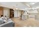 Finished basement with tile flooring, a kitchenette, and a seating area at 1051 Independence St, Lakewood, CO 80215