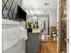 Bright bathroom featuring mirrored wall, granite vanity, and a glass-enclosed shower at 1051 Independence St, Lakewood, CO 80215