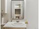Well-lit bathroom featuring a classic sink, mirror, and ample counter space at 1051 Independence St, Lakewood, CO 80215