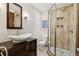 Updated bathroom with sleek vanity, glass-enclosed shower, and modern fixtures at 1051 Independence St, Lakewood, CO 80215
