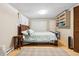 Bedroom featuring a comfortable bed, ample closet space, and a cozy atmosphere at 1051 Independence St, Lakewood, CO 80215