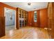 Formal dining room with hardwood floors, built-in cabinet, and window at 1051 Independence St, Lakewood, CO 80215