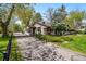 Charming single-story home with mature trees and a well-maintained yard at 1051 Independence St, Lakewood, CO 80215