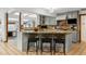 Stylish kitchen with breakfast bar, pendant lighting, and granite countertops at 1051 Independence St, Lakewood, CO 80215