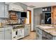 Updated kitchen featuring stainless steel appliances and granite countertops at 1051 Independence St, Lakewood, CO 80215