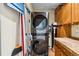 Functional laundry area featuring a stacked washer and dryer at 1051 Independence St, Lakewood, CO 80215