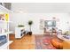 Open-concept living room showcasing a large rug, neutral-toned furniture, and stylish decor at 800 Washington St # 302, Denver, CO 80203