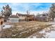 Expansive backyard with a covered wood deck, perfect for outdoor entertaining at 1520 Phillips Dr, Northglenn, CO 80233