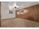 This bedroom features carpet and wooden paneling at 1520 Phillips Dr, Northglenn, CO 80233