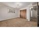 This bedroom features carpet and a closet at 1520 Phillips Dr, Northglenn, CO 80233