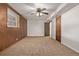 This bedroom features carpet and a ceiling fan at 1520 Phillips Dr, Northglenn, CO 80233