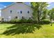 Expansive backyard offers privacy with mature landscaping and a well-manicured lawn, ideal for outdoor enjoyment at 4797 Flower St, Wheat Ridge, CO 80033