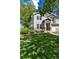 Attractive townhome showcasing a green lawn and cozy outdoor seating area at 4797 Flower St, Wheat Ridge, CO 80033