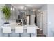 Modern kitchen with ample counter space, stainless steel appliances, and stylish grey cabinetry, perfect for cooking at 4797 Flower St, Wheat Ridge, CO 80033