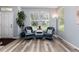 Comfortable living room with wood floors, large windows, and stylish furnishings at 4797 Flower St, Wheat Ridge, CO 80033