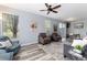 Cozy living area with plush seating, wood floors, and sliding glass doors at 4797 Flower St, Wheat Ridge, CO 80033