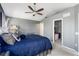 Spacious bedroom with gray carpet, vaulted ceiling, and ensuite bathroom at 4797 Flower St, Wheat Ridge, CO 80033