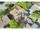 Aerial view of home with solar panels and fenced backyard at 1713 S Holland St, Lakewood, CO 80232
