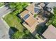 Aerial view of home with solar panels, patio with seating, and a playground at 1713 S Holland St, Lakewood, CO 80232