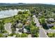 A scenic aerial view showcases the property near a lake and green spaces at 1713 S Holland St, Lakewood, CO 80232