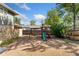 Backyard playground with a swing set and slide at 1713 S Holland St, Lakewood, CO 80232