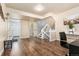 Finished basement area featuring durable flooring, neutral paint, ample space and stairs to main level at 1713 S Holland St, Lakewood, CO 80232