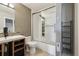 Bright bathroom featuring modern vanity, shower with multi-spray system, and glass door at 1811 S Quebec Way # 60, Denver, CO 80231