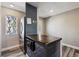 Kitchen featuring a stainless steel refrigerator, microwave, and dark countertop island at 1811 S Quebec Way # 60, Denver, CO 80231