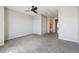 Open primary bedroom with plush gray carpeting and en-suite bathroom access at 1811 S Quebec Way # 60, Denver, CO 80231