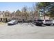 Street view showcasing a row of townhomes with convenient parking spaces at 1811 S Quebec Way # 60, Denver, CO 80231