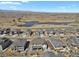 An aerial shot of a neighborhood with a large pond, expansive views, and easy access to the highway at 3422 W 155Th Ave, Broomfield, CO 80023