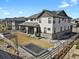 Large backyard featuring lush green grass, a trampoline, and a stone seating area at 3422 W 155Th Ave, Broomfield, CO 80023