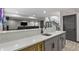 Basement bar area features a quartz countertop, mini fridge, and staircase to the main floor at 3422 W 155Th Ave, Broomfield, CO 80023