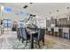 Open-concept dining room with modern lighting, with view to kitchen and living spaces at 3422 W 155Th Ave, Broomfield, CO 80023